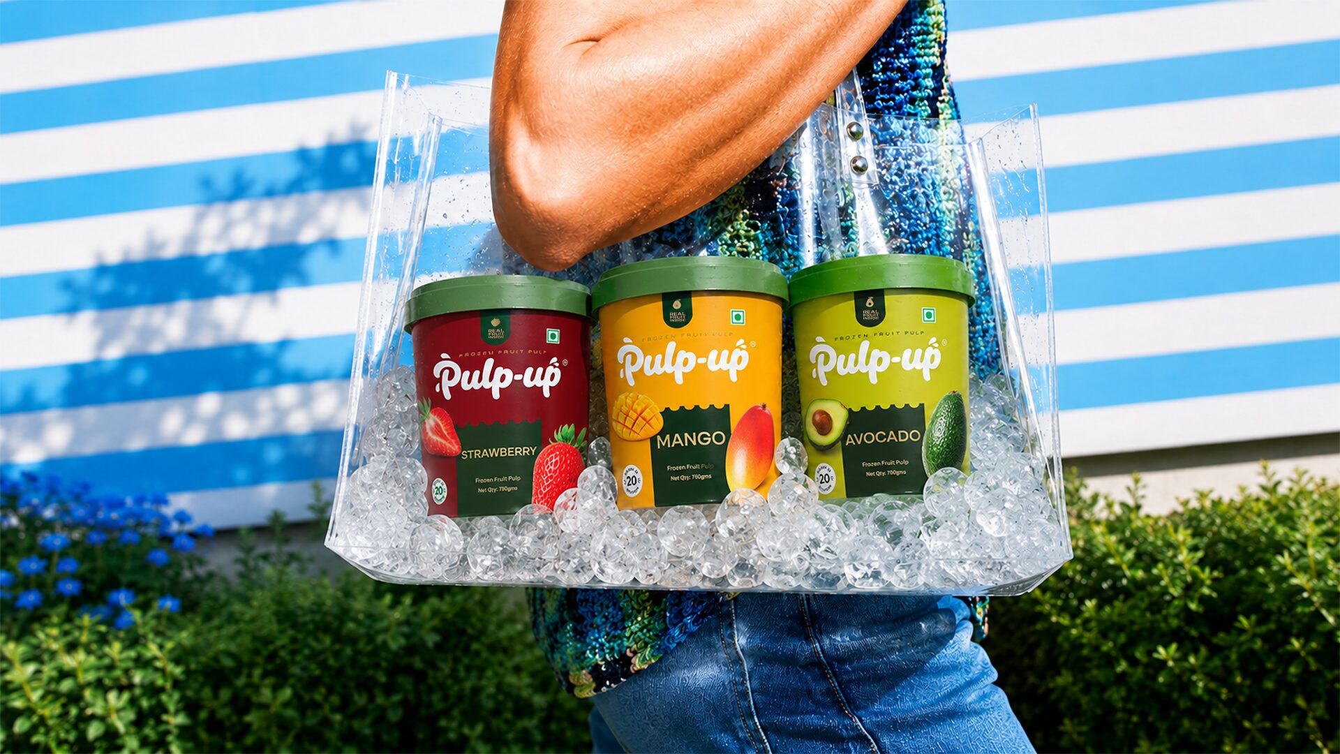 Three Pulp-up tubs in a clear tote filled with ice